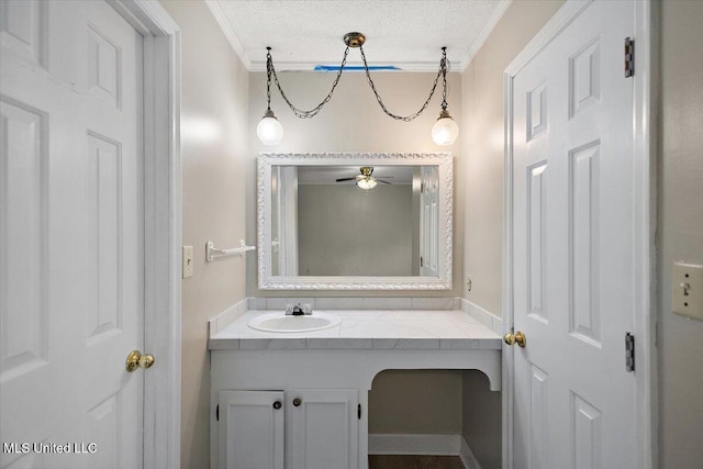 244 Massey Cir, Carthage, MS 39051 - bathroom featuring ornamental molding, a ceiling fan, vanity, and a textured ceiling