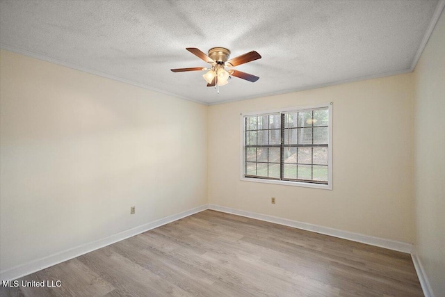 244 Massey Cir, Carthage, MS 39051 - spare room featuring wood finished floors, crown molding, a ceiling fan, a textured ceiling, and baseboards