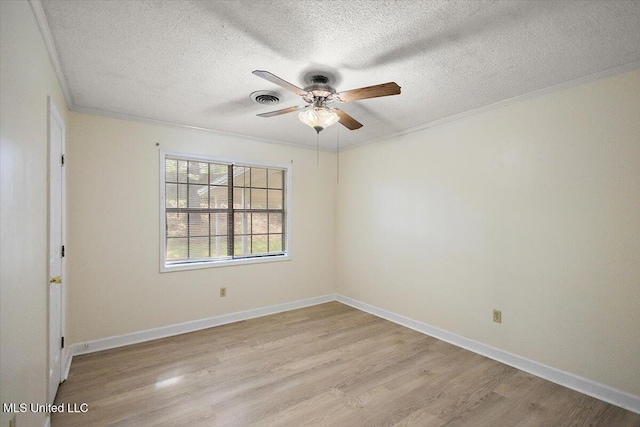 244 Massey Cir, Carthage, MS 39051 - empty room featuring crown molding, a textured ceiling, light wood-style floors, ceiling fan, and baseboards