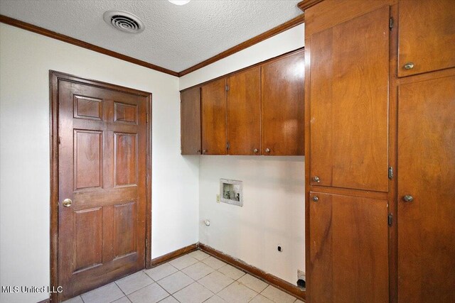 244 Massey Cir, Carthage, MS 39051 - washroom featuring cabinet space, electric dryer hookup, hookup for a washing machine, ornamental molding, and a textured ceiling