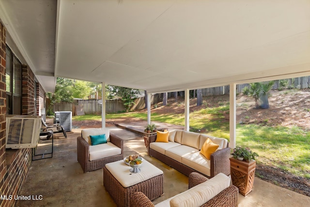 244 Massey Cir, Carthage, MS 39051 - fenced backyard featuring an outdoor hangout area, a patio area, and central AC