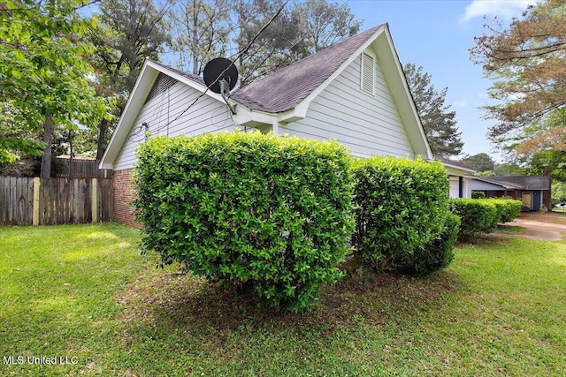244 Massey Cir, Carthage, MS 39051 - view of property exterior with a shingled roof and brick siding