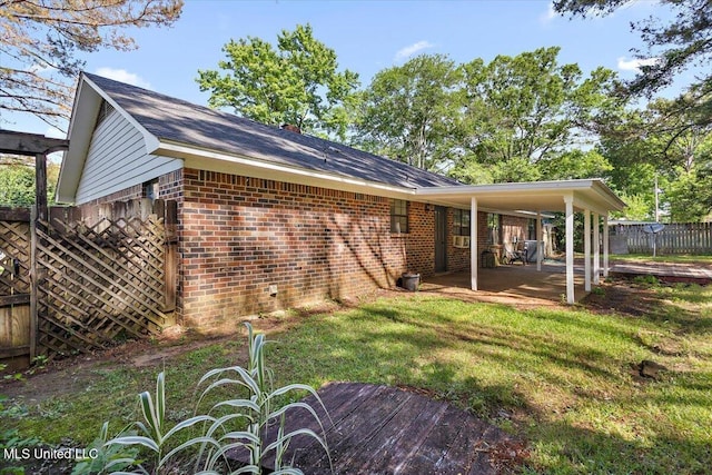 244 Massey Cir, Carthage, MS 39051 - back of house with brick siding and a patio area