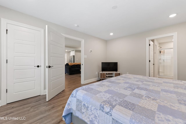 14172 Debra Barbee Ct, Gulfport, MS 39503 - bedroom with wood finished floors, baseboards, recessed lighting, and ensuite bathroom