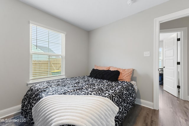 14172 Debra Barbee Ct, Gulfport, MS 39503 - bedroom featuring wood finished floors, multiple windows, and baseboards