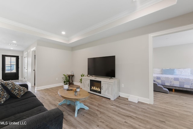 14172 Debra Barbee Ct, Gulfport, MS 39503 - living room with light wood-type flooring, crown molding, baseboards, recessed lighting, and a warm lit fireplace