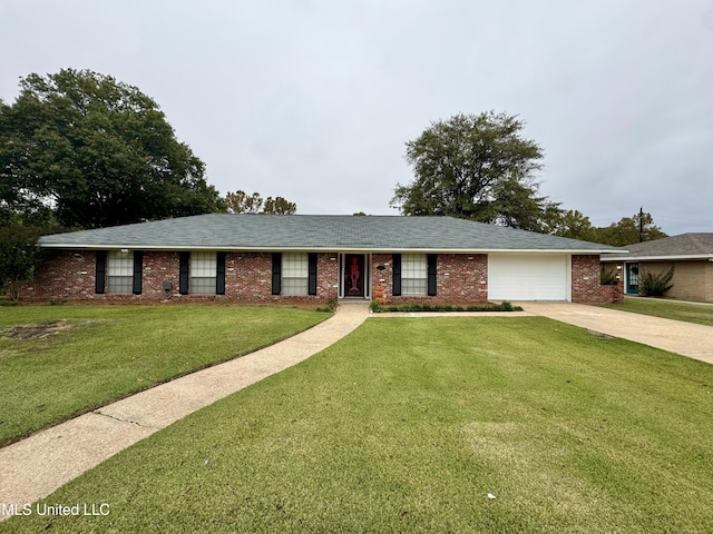 single story home featuring a garage and a front yard