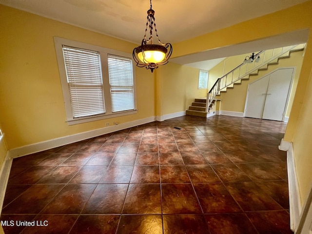 tiled empty room with a healthy amount of sunlight