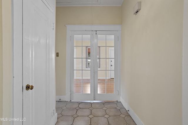 doorway to outside featuring french doors and baseboards