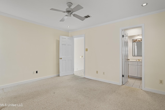 unfurnished bedroom with ensuite bathroom, recessed lighting, light carpet, baseboards, and crown molding