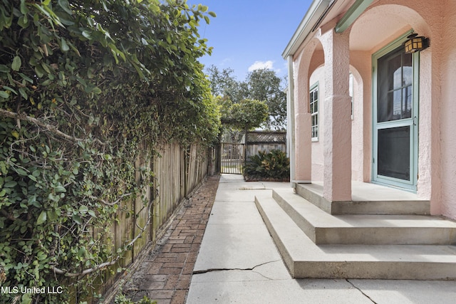 view of property exterior with fence