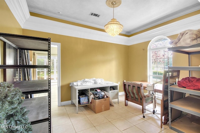 interior space featuring a tray ceiling, an inviting chandelier, and ornamental molding