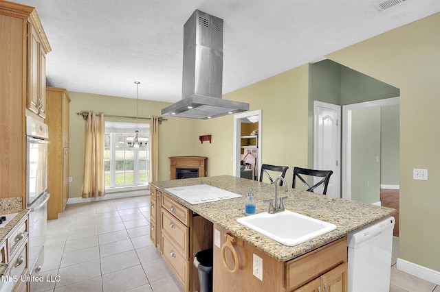 kitchen featuring dishwasher, sink, an island with sink, wall oven, and island exhaust hood