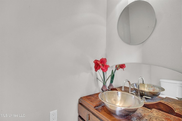 bathroom with toilet and sink