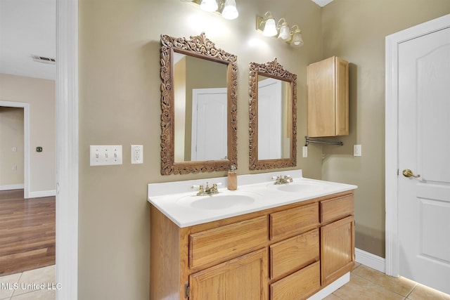 bathroom with hardwood / wood-style flooring and vanity