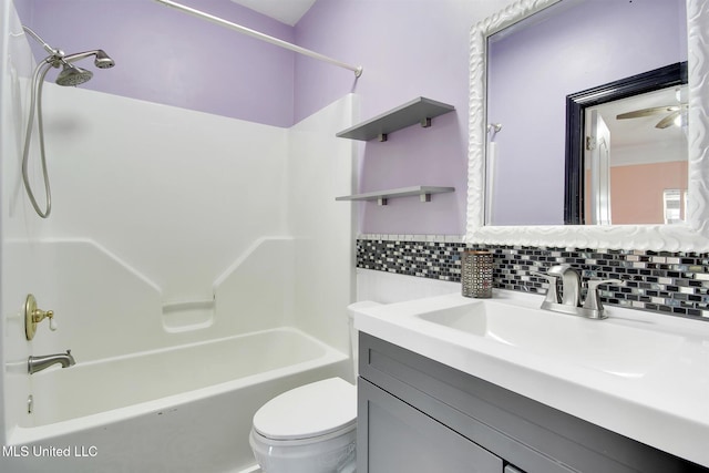 full bathroom with backsplash, vanity, tub / shower combination, and toilet