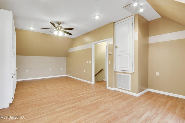 additional living space with ceiling fan, light hardwood / wood-style floors, and lofted ceiling