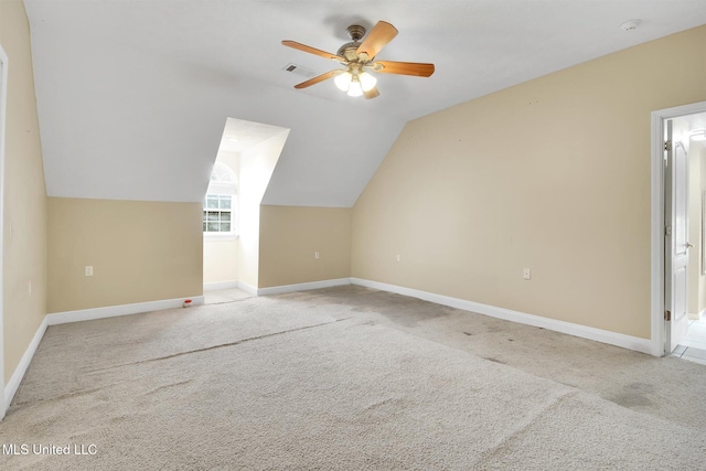 bonus room featuring ceiling fan, light colored carpet, and vaulted ceiling