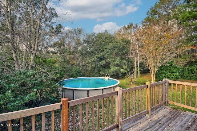 view of pool with a deck