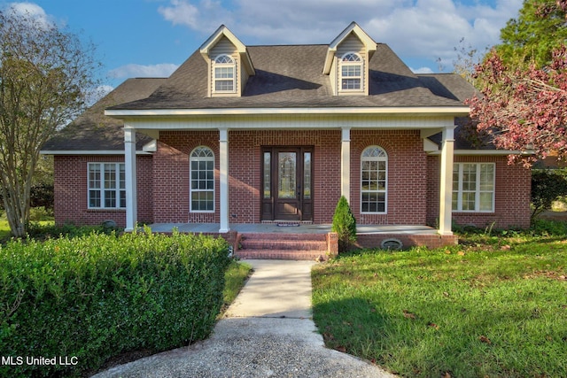 view of front of house featuring a porch and a front lawn