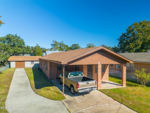 single story home with a front lawn and a carport