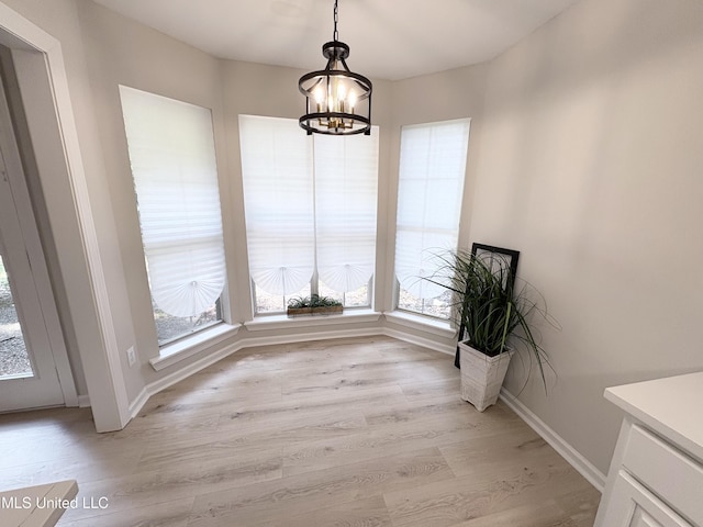 106 Ole Duke Dr, Brandon, MS 39042 - unfurnished dining area featuring a chandelier, light wood-style floors, and baseboards