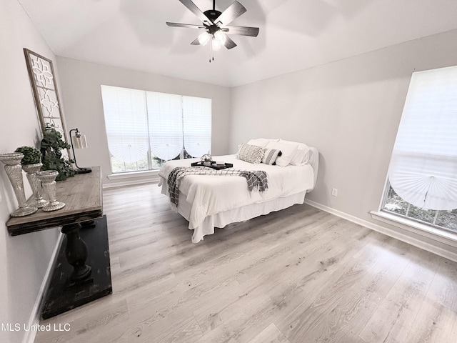 106 Ole Duke Dr, Brandon, MS 39042 - bedroom featuring wood finished floors, baseboards, lofted ceiling, and a ceiling fan