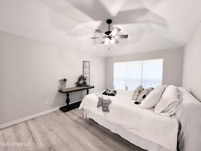 106 Ole Duke Dr, Brandon, MS 39042 - bedroom featuring wood finished floors, vaulted ceiling, baseboards, and a ceiling fan