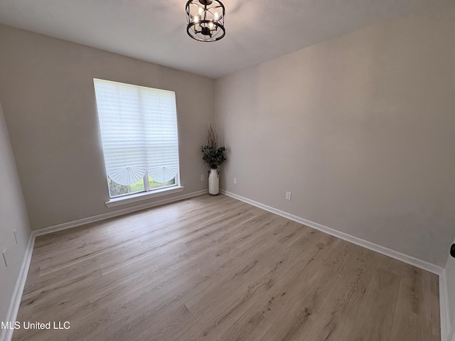 106 Ole Duke Dr, Brandon, MS 39042 - unfurnished room with a chandelier, wood finished floors, and baseboards