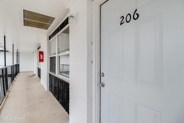 hallway with concrete flooring