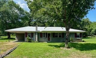 176 Revell Rd, Grenada, MS 38901 - ranch-style house featuring dirt driveway, a front lawn, and a carport