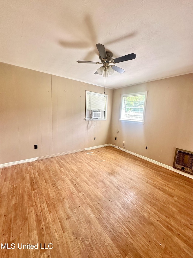 176 Revell Rd, Grenada, MS 38901 - empty room featuring light wood-style flooring, ceiling fan, baseboards, and cooling unit