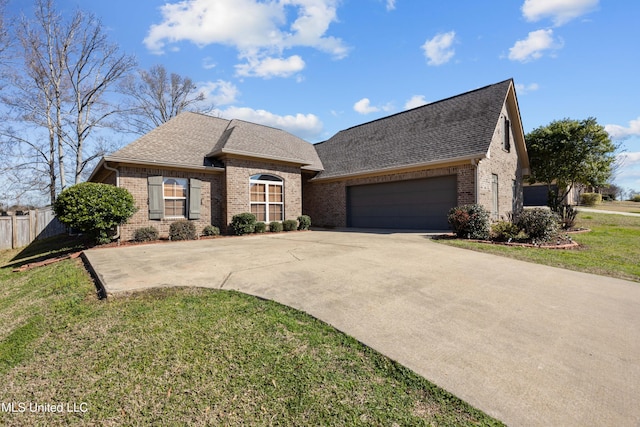 french country style house featuring a garage, brick siding, driveway, and roof with shingles