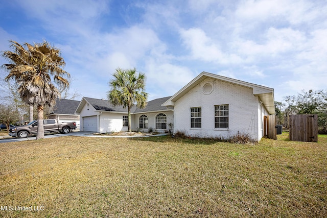 ranch-style house featuring driveway, brick siding, an attached garage, fence, and a front yard