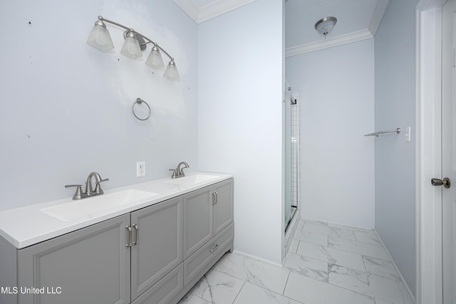 bathroom featuring marble finish floor, ornamental molding, and a sink