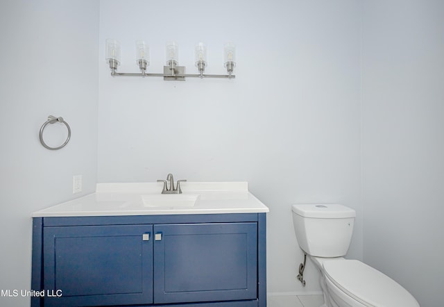 half bath with toilet and vanity