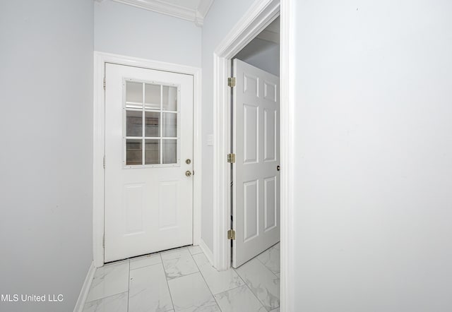 doorway to outside featuring marble finish floor, ornamental molding, and baseboards