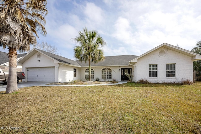 single story home featuring an attached garage, brick siding, driveway, and a front yard