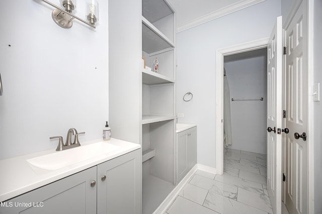 full bath featuring vanity, baseboards, marble finish floor, a closet, and crown molding