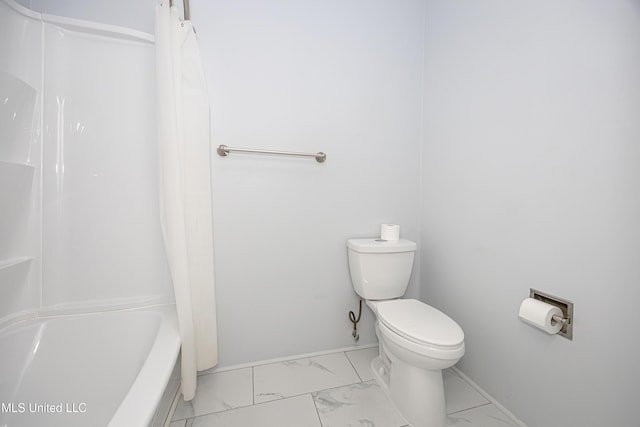 full bath with marble finish floor, shower / bath combo, toilet, and baseboards