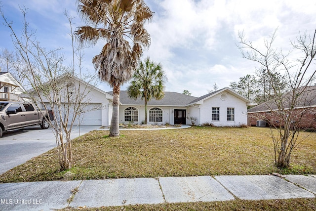 single story home with a garage, a front yard, and driveway