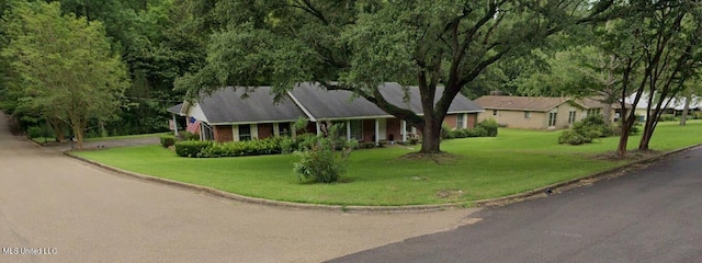 ranch-style home with a front lawn