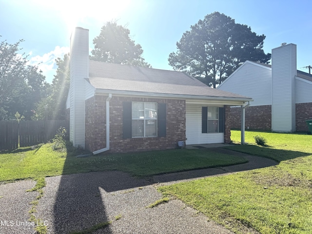 2005 Foxhill Ln, Byram, MS 39272 - view of front facade with brick siding and a chimney