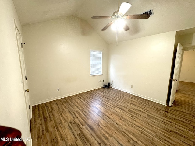 2005 Foxhill Ln, Byram, MS 39272 - unfurnished bedroom with wood finished floors, vaulted ceiling, and ceiling fan