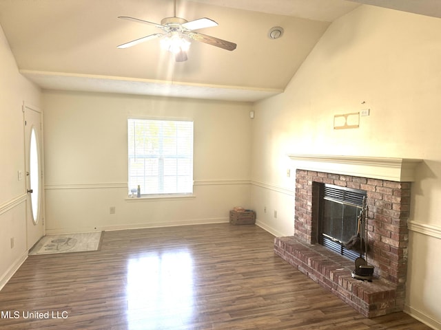2005 Foxhill Ln, Byram, MS 39272 - unfurnished living room featuring wood finished floors, ceiling fan, a fireplace, and vaulted ceiling