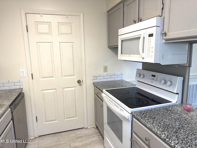 2005 Foxhill Ln, Byram, MS 39272 - kitchen with white appliances, gray cabinets, dark stone counters, and light wood finished floors