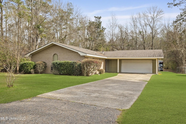 view of front of house featuring a garage, driveway, a front lawn, and brick siding