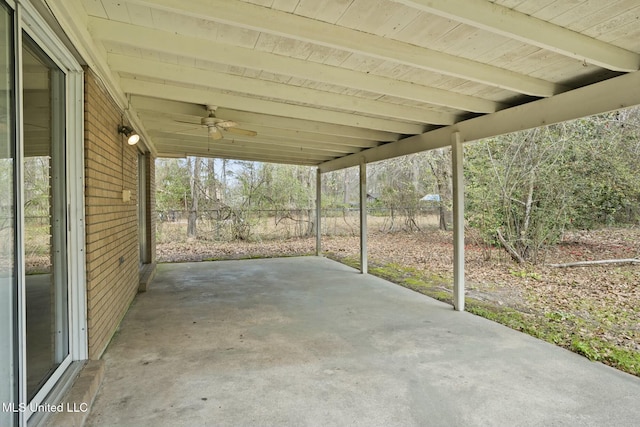 view of patio / terrace with a ceiling fan and fence