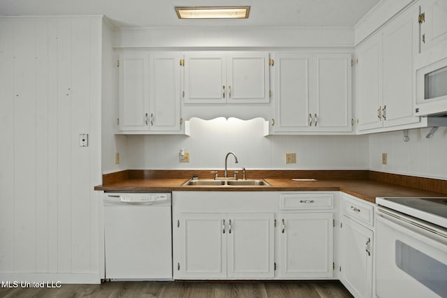 kitchen with white appliances, white cabinetry, dark wood-style flooring, and a sink