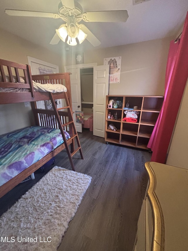 bedroom featuring ceiling fan and dark hardwood / wood-style flooring